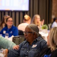 person with hand on person's arm